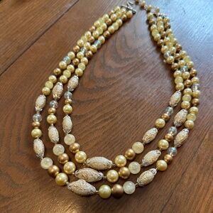 triple row golden bead necklace
